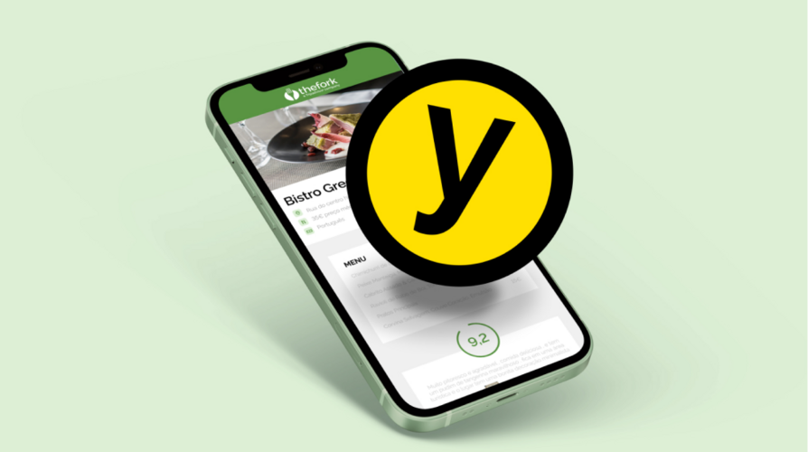 Yums-Icon mit Smartphone im Hintergrund