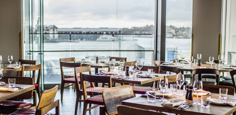 The dining room at The Meat & Wine Co in Barangaroo with views of the harbour