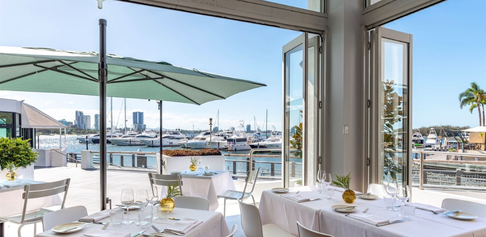 The dining room with sweeping water views at Gods of the Sea
