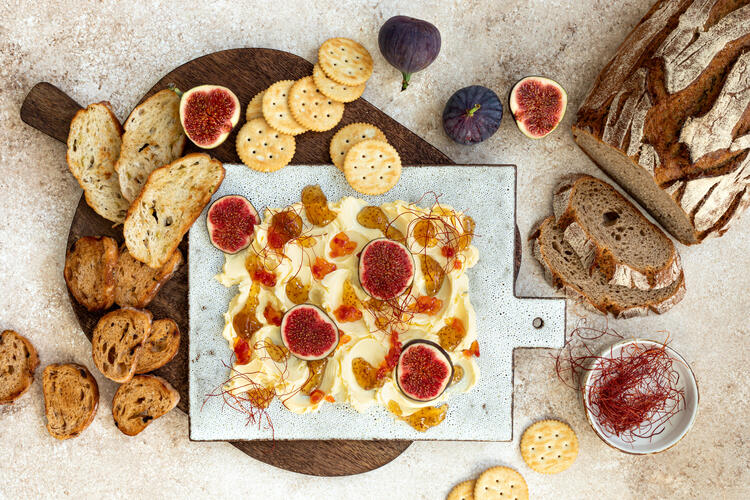Butter board with berries and figs, served with bread