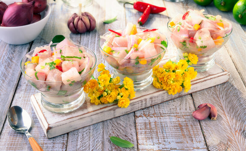 Three bowls of seafood ceviche, one of the most famous Peruvian foods
