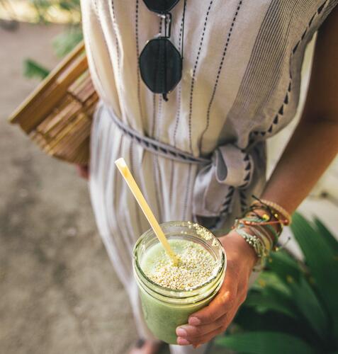 Woman with green smoothie during a smoothie diet plan