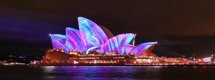 Opera House lit up at night during Vivid Sydney